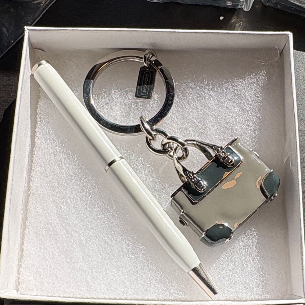 Coach handbag keychain and CoachWhite mini Pen.